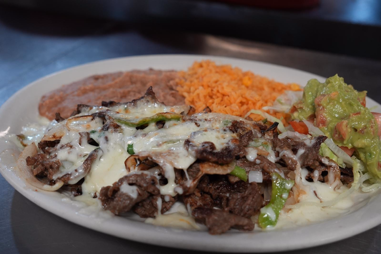 Taqueria Garibaldi Fajitas Flameada with melted cheese